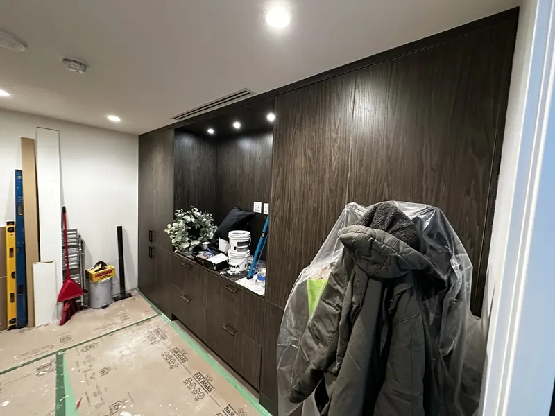 Before: the original dark wood home office cabinetry